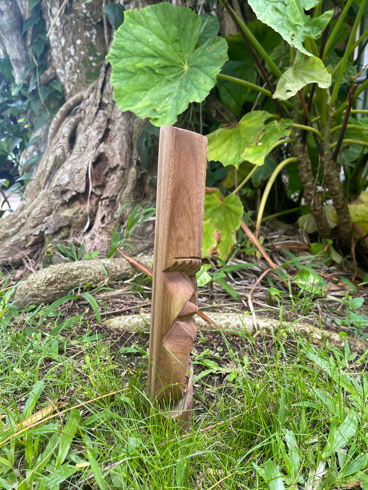 Side View of Hand-carved Protector Wood Tiki with Wave Symbol