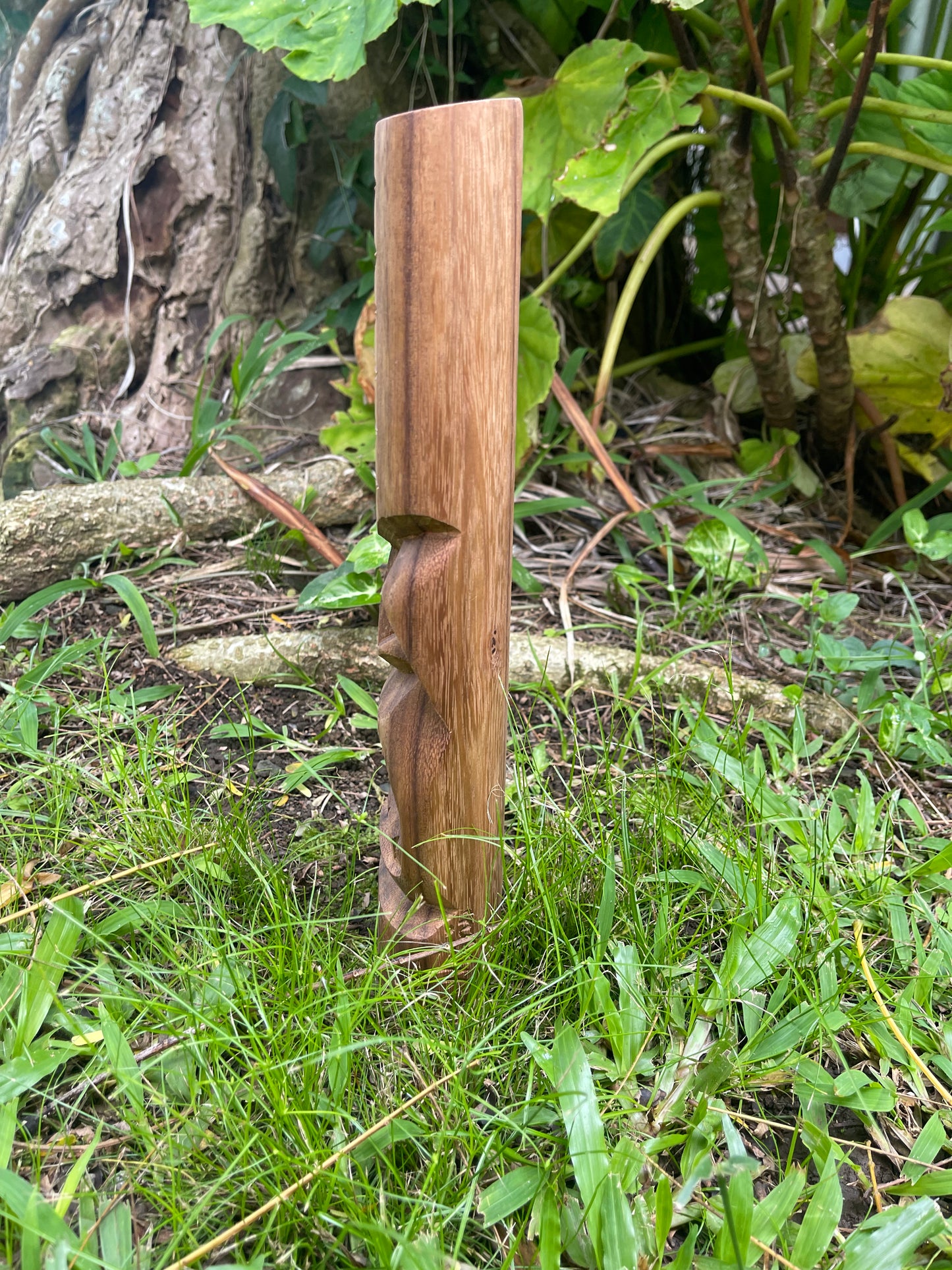 Side View of Hand-carved Protector Wood Tiki with Wave Symbol