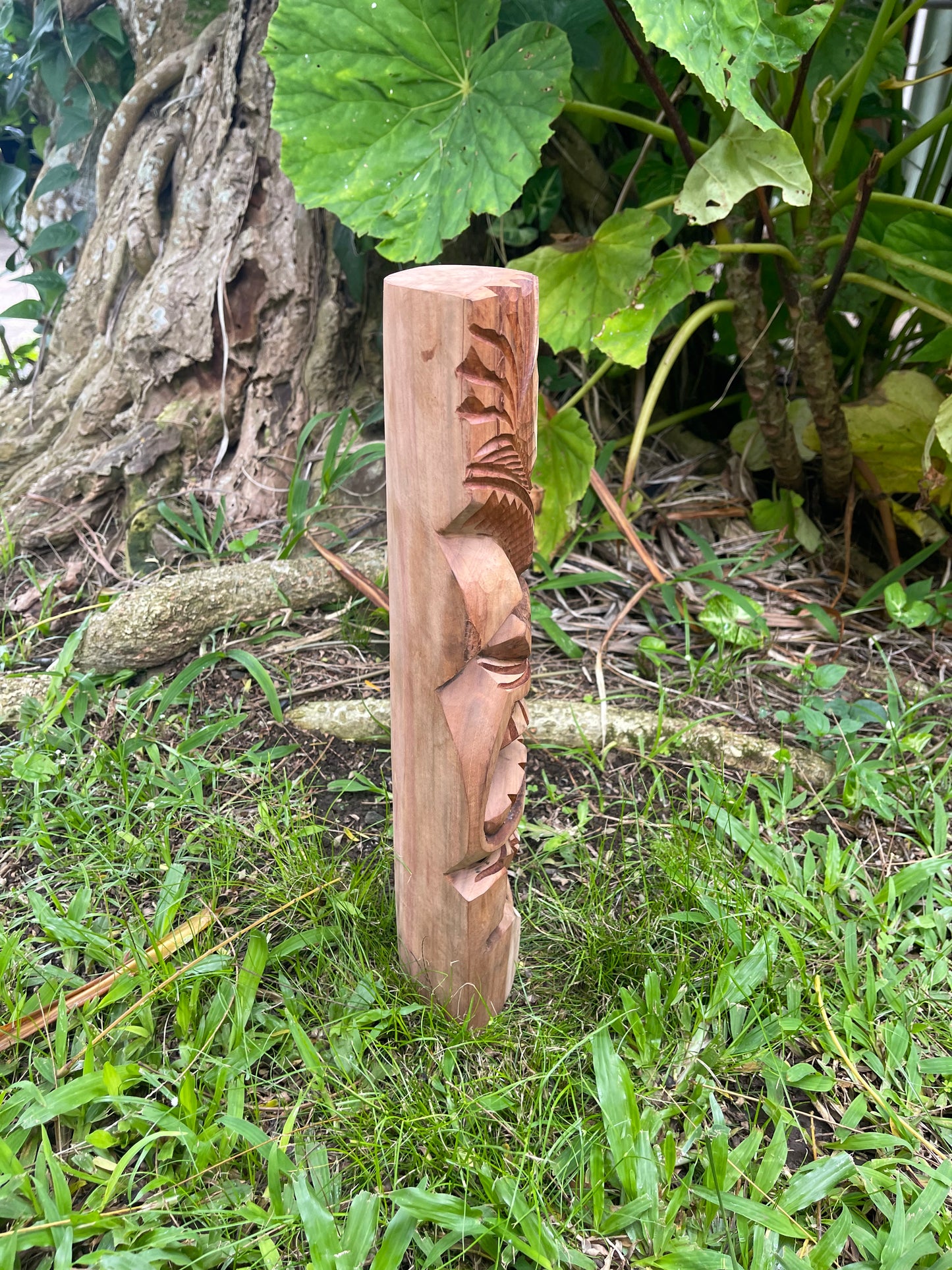 Side view of Hand-Carved Protector Tiki with Swirl Design