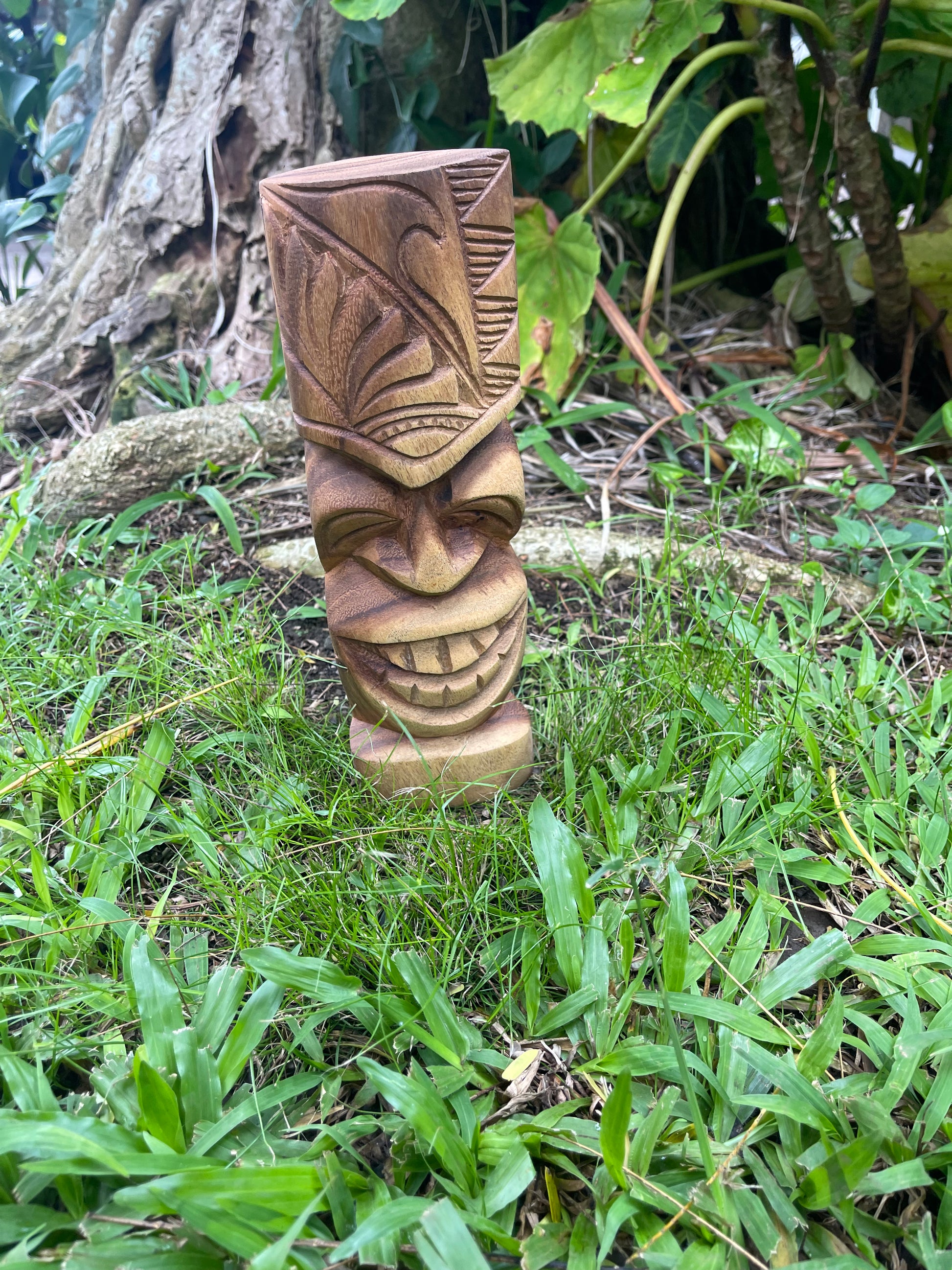 Smiling Tiki with Wave and Island Designs