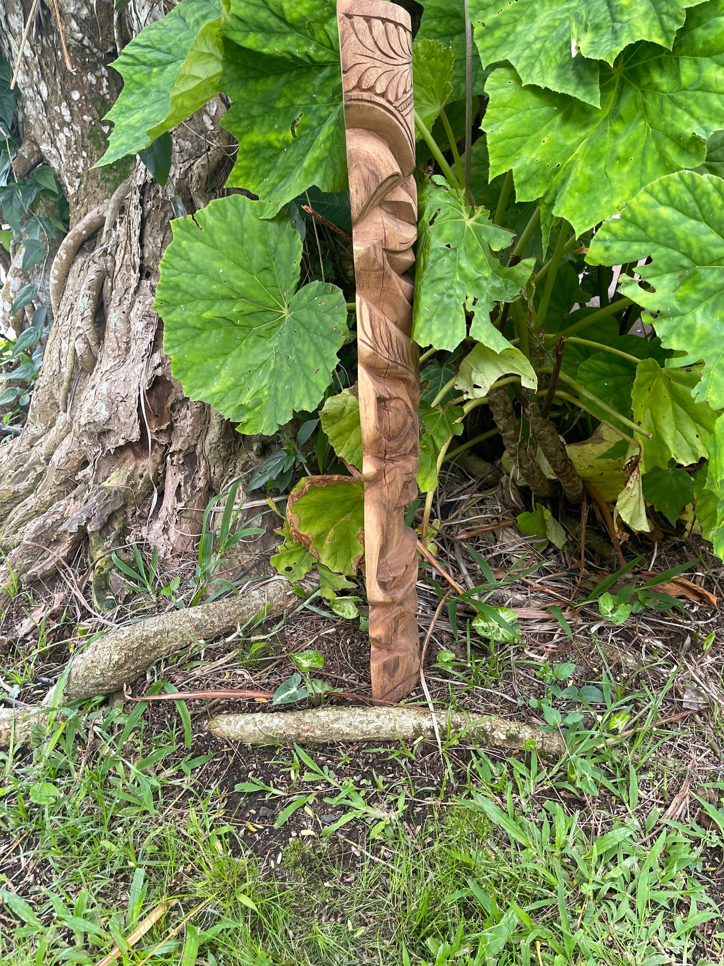 Side View of Hand-Carved Protection and Happiness Tiki